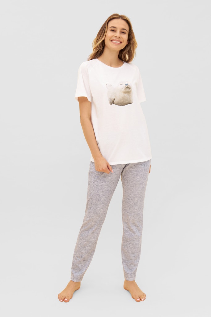 Women is wearing Be Happy Jersey Cotton Classic T-Shirt with seal print front picture with matching bottom ( sold separately)